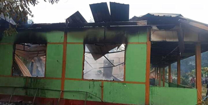 The wall of a school structure is left standing after it was burned in Taung Myint village in the Magway region of Myanmar on Sunday, Oct. 16, 2022. Photo: AP