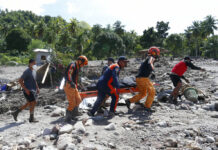 Nearly 100 Dead, Dozens Missing in Storm-ravaged Philippines Rescuers carry a body at Maguindanao's Datu Odin Sinsuat town, southern Philippines on Sunday Oct. 30, 2022. Photo: AP