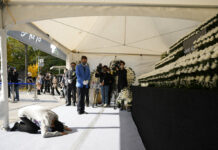 South Korea Probes Halloween Crowd Surge as Nation Mourns A mourner bows to pay tribute for the victims of a deadly accident following Saturday night's Halloween festivities, at a joint memorial altar set near the scene in Seoul, South Korea, Monday, Oct. 31, 2022. Photo: Lee Jin-man / AP