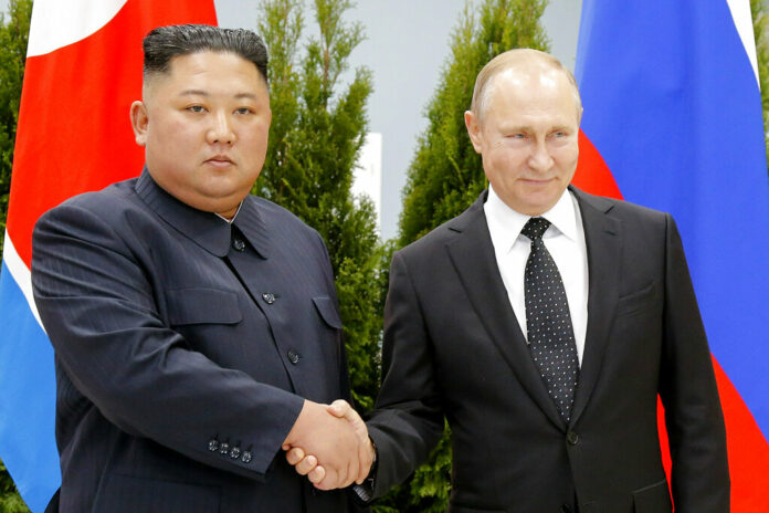 FILE - Russian President Vladimir Putin, right, and North Korea's leader Kim Jong Un shake hands during their meeting in Vladivostok, Russia on April 25, 2019. Photo: Alexander Zemlianichenko / Pool / AP File