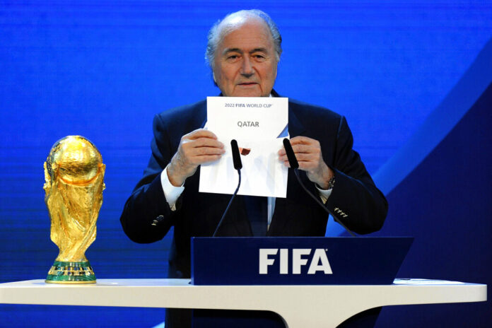FILE - FIFA President Joseph S. Blatter announces that Qatar will be hosting the 2022 Soccer World Cup, on Thursday, Dec. 2, 2010, during the FIFA 2018 and 2022 World Cup Bid Announcement in Zurich, Switzerland. Photo: Keystone / Walter Bieri / AP File