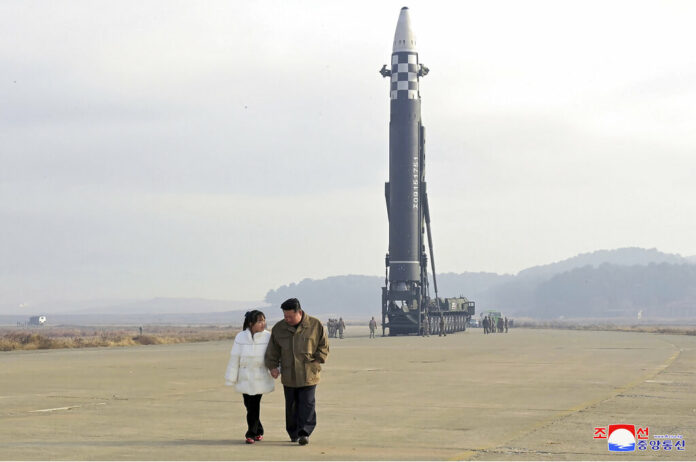 FILE - This photo provided on Nov. 19, 2022, by the North Korean government shows North Korean leader Kim Jong Un, right, and his daughter at the site of a missile launch at Pyongyang International Airport in Pyongyang, North Korea, Friday, Nov. 18, 2022. Independent journalists were not given access to cover the event depicted in this image distributed by the North Korean government. The content of this image is as provided and cannot be independently verified. Korean language watermark on image as provided by source reads: 