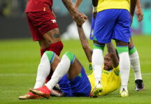 Neymar Injured, Richarlison Scores for Brazil at World Cup Brazil's Neymar is helped back on his feet during the World Cup group G soccer match between Brazil and Serbia, at the Lusail Stadium in Lusail, Qatar, Thursday, Nov. 24, 2022. Photo: Andre Penner / AP