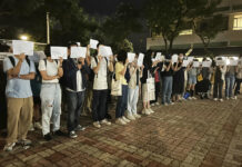 China Lockdown Protests Pause as Police Flood City Streets Protesters hold up blank white papers during a commemoration for victims of a recent Urumqi deadly fire at the Chinese University of Hong Kong in Hong Kong, Monday, Nov. 28, 2022. Photo: Kanis Leung / AP