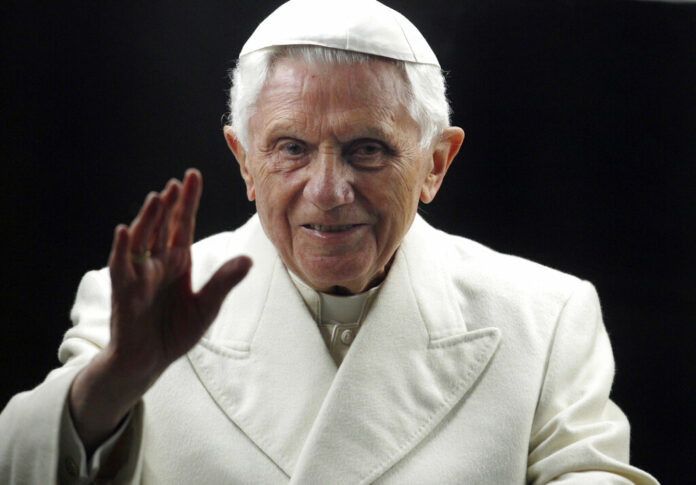 FILE - Pope Benedict XVI blesses the faithful as he arrives in St. Peter's Square at the Vatican to bless the nativity scene on Dec. 31, 2011. Photo: Pier Paolo Cito / AP File