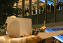 Chinese Users Play Cat-and-Mouse With Censors Amid Protests People watch from above at a protest gathering at the University of Hong Kong in Hong Kong, Tuesday, Nov. 29, 2022. Photo: Bertha Wang / AP
