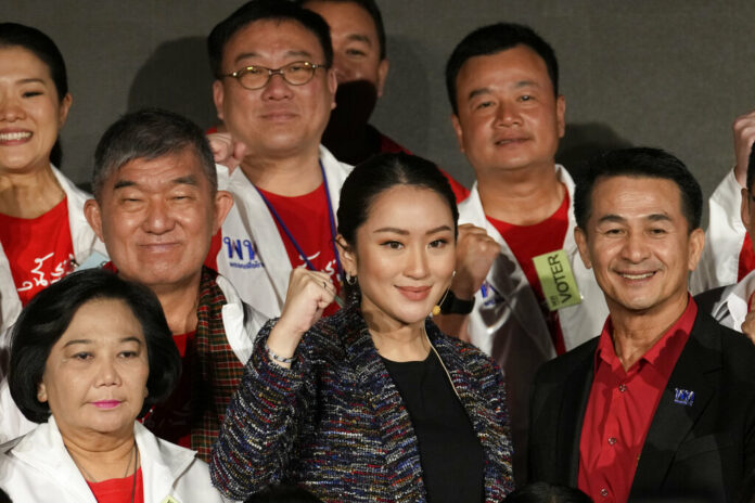 The daughter of Thailand's former Prime Minister Thaksin Shinawatra, Paetongtarn Shinawatra cheers with supporters during a Pheu Thai party general assembly meeting in Bangkok, Thailand, Tuesday, Dec. 6, 2022. Photo: Sakchai Lalit / AP