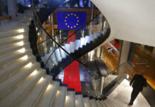 Police Raid More EU Parliament Offices in Corruption Probe A man walks down stairs during a special session on lobbying Monday, Dec. 12, 2022 at the European Parliament in Strasbourg, eastern France. Photo: Jean-Francois Badias / AP
