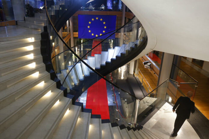 A man walks down stairs during a special session on lobbying Monday, Dec. 12, 2022 at the European Parliament in Strasbourg, eastern France. Photo: Jean-Francois Badias / AP