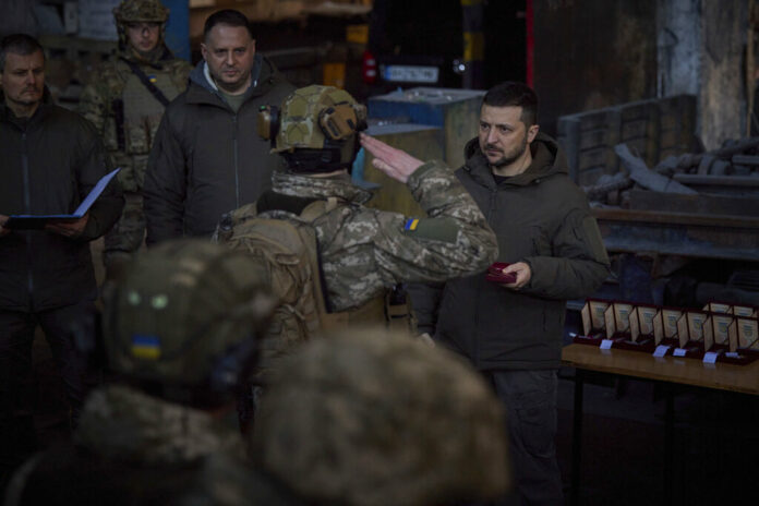 In this photo provided by the Ukrainian Presidential Press Office, Ukrainian President Volodymyr Zelenskyy, right, awards a serviceman at the site of the heaviest battles with the Russian invaders in Bakhmut, Ukraine, Tuesday, Dec. 20, 2022. Photo: Ukrainian Presidential Press Office via AP In this photo provided by the Ukrainian Presidential Press Office, Ukrainian President Volodymyr Zelenskyy, right, awards a serviceman at the site of the heaviest battles with the Russian invaders in Bakhmut, Ukraine, Tuesday, Dec. 20, 2022. Photo: Ukrainian Presidential Press Office via AP