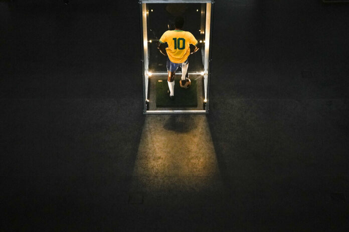 A life size statue of Brazilian soccer legend is on display at Pele Museum in Santos, Brazil, Monday, Dec. 26, 2022. Photo: Matias Delacroix / AP