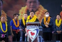 Bhumjaithai Party leader Anutin Charnvirakul speaks to his supporters in Nakhon Phanom province on Dec. 4, 2022.