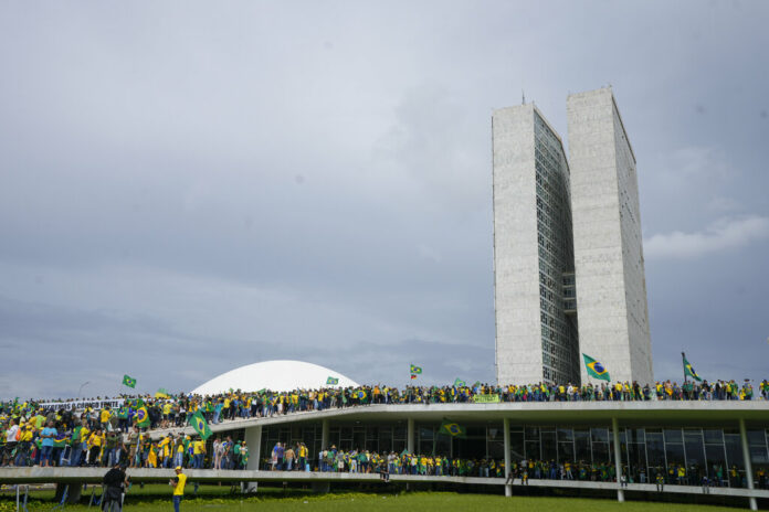 Protesters, supporters of Brazil's former President Jair Bolsonaro, storm the the National Congress building in Brasilia, Brazil, Sunday, Jan. 8, 2023. Photo: Eraldo Peres / AP Protesters, supporters of Brazil's former President Jair Bolsonaro, storm the the National Congress building in Brasilia, Brazil, Sunday, Jan. 8, 2023. Photo: Eraldo Peres / AP