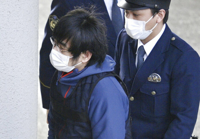 Tetsuya Yamagami, the alleged assassin of Japan's former Prime Minister Shinzo Abe, enters a police station in Nara, western Japan, on Jan. 10, 2023. Photo: Kyodo News via AP