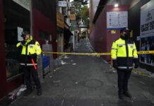 S. Korean Police Seek Manslaughter Charges Over Deadly Crush FILE- Police officers stand guard at the scene where dozens of people died and were injured during a crowd surge in Seoul, South Korea, on Oct. 30, 2022. Photo: Ahn Young-joon / AP File