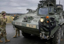 Defense Leaders Meet Amid Dissent Over Tanks for Ukraine FILE - Soldiers of the 2nd Cavalry Regiment stand next to a Stryker combat vehicle in Vilseck, Germany, Wednesday, Feb. 9, 2022. Photo: Michael Probst / AP File