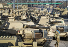 In Reversal, US Poised To Approve Abrams Tanks for Ukraine FILE - A soldier walks past a line of M1 Abrams tanks, Nov. 29, 2016, at Fort Carson in Colorado Springs, Colo. Photo: Christian Murdock/The Gazette via AP File
