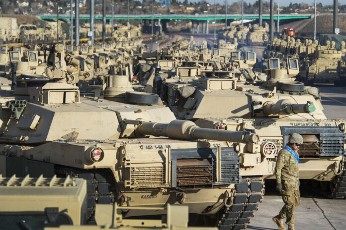 FILE - A soldier walks past a line of M1 Abrams tanks, Nov. 29, 2016, at Fort Carson in Colorado Springs, Colo. Photo: Christian Murdock/The Gazette via AP File