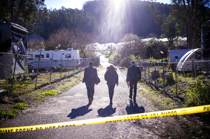 FBI officials walk towards the crime scene at Mountain Mushroom Farm, Tuesday, Jan. 24, 2023, after a gunman killed several people at two agricultural businesses in Half Moon Bay, Calif. Photo: Aaron Kehoe / AP