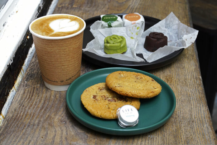 FILE - Coffee, biscuits, green tea and chocolate mooncake that contain cannabidiol, or CBD, a substance from the cannabis plant, are displayed at the Found Cafe in Hong Kong on Sept. 13, 2020. Photo: Vincent Yu / AP File