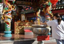 Opinion: Thai-Chinese and Debt of Gratitude A woman offers incense sticks to a shrine in Yaowarat, Bangkok on Jan. 21, 2023.