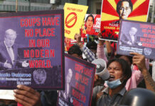 Myanmar Resistance Steadfast Against Army Rule 2 Years Later FILE - Anti-coup protesters hold up signs as they march in Mandalay, Myanmar Sunday, March 14, 2021. Photo: AP FIle