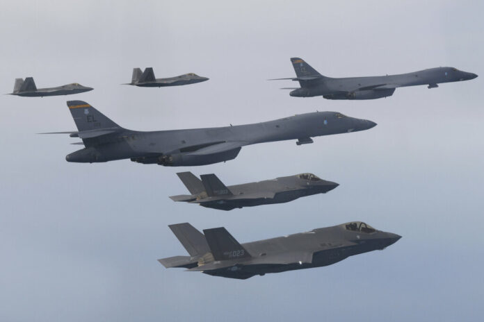 In this photo provided by South Korean Defense Ministry, U.S. Air Force B-1B bombers, center, F-22 fighter jets and South Korean Air Force F-35 fighter jets, bottom, fly over South Korea Peninsula during a joint air drill in South Korea, Wednesday, Jan. 1, 2023. Photo: South Korean Defense Ministry via AP In this photo provided by South Korean Defense Ministry, U.S. Air Force B-1B bombers, center, F-22 fighter jets and South Korean Air Force F-35 fighter jets, bottom, fly over South Korea Peninsula during a joint air drill in South Korea, Wednesday, Jan. 1, 2023. Photo: South Korean Defense Ministry via AP