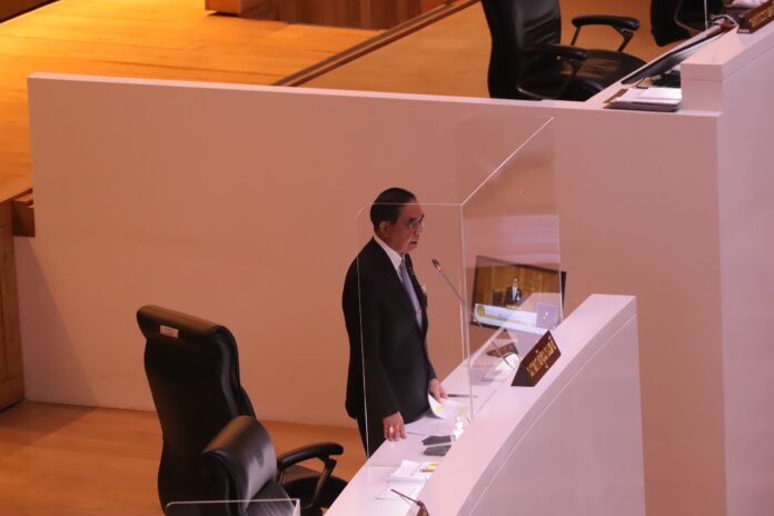 PM Prayut Chan-o-cha addresses the Parliament during a debate on Feb. 16, 2023. PM Prayut Chan-o-cha addresses the Parliament during a debate on Feb. 16, 2023.