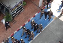 Opinion: The Labyrinth That Is Corruption in Thailand Police escort fellow officers who are involved in the alleged extortion of Taiwanese actress Charlene An, while leaving the Metropolitan Police Bureau on Feb. 2, 2023.
