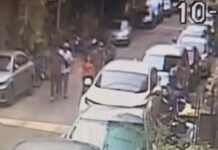 Immigration Cops Accused of Kidnapping Chinese National Security camera shows the victims being pulled into a car in Bangkok’s Din Daeng district on Mar. 10, 2023.