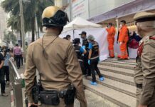 Police Arrested Myanmar Migrant Worker in Killing of Another at Bangkok Mall Forensic police inspect the scene of a fatal stabbing in front of Platinum Fashion Mall in Bangkok on Mar. 9, 2023.