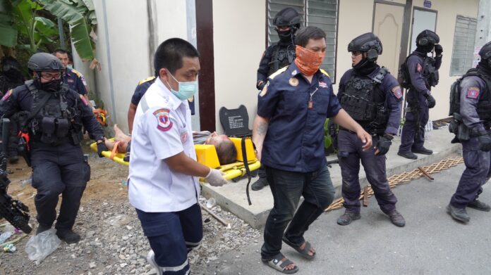 Rescue workers transport the wounded gunman to hospital on Mar. 15, 2023. Rescue workers transport the wounded gunman to hospital on Mar. 15, 2023.