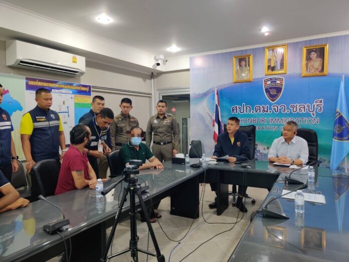 Khalid Majeed Ali Ali, in green shirt, at Chonburi Immigration Office on Mar. 28, 2023.