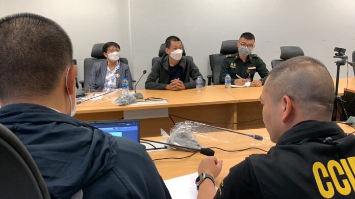 Sgt. Maj. Khemarat Boonchuay, center, accompanied by a military officer at the Cyber Crime Investigation Bureau on Apr. 12, 2023. Sgt. Maj. Khemarat Boonchuay, center, accompanied by a military officer at the Cyber Crime Investigation Bureau on Apr. 12, 2023.