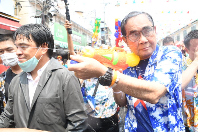 Gen. Prayut Chan-o-cha joins the waterfight on Khaosan Road on Apr. 14, 2023.