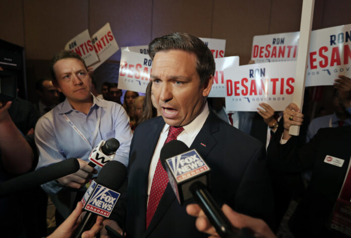 Rep. Ron DeSantis, R-Fla., answers questions from reporters after a Florida Republican gubernatorial primary debate at the Republican Sunshine Summit June 28, 2018, in Kissimmee, Fla. Photo: John Raoux / AP File
