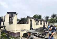 Prosecutors in Guyana Mull Charges for Teen Suspect in Deadly Blaze at Girl’s Dorm In this photo provided by Guyana's Department of Public Information, the dormitory of a secondary school is burned in Mahdia, Guyana, Monday, May 22, 2023. Photo: Guyana's Department of Public Information via AP Photo