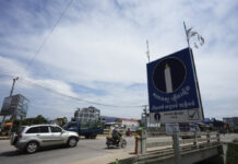 Cambodia’s Top Opposition Party Barred From July Elections, Leaving Hun Sen’s Party Unchallenged Political party Candlelight Party's poster, right, is displayed near a bridge outside Phnom Penh, Cambodia, Thursday, May 25, 2023. Photo: Heng Sinith / AP