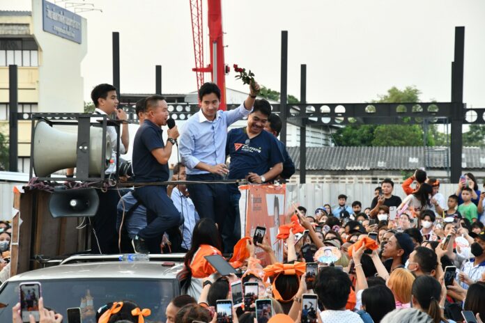 Move Forward Party leader Pita Limjaroenrat waves to his supporters in Samut Prakan province on May 26, 2023.