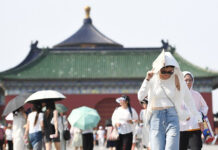 China Renews Yellow Alert for High Temperatures; Flood Killed 15