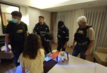 Call Center Gang Tricks Student Into Staging Her Own Abduction for Ransom Police officers question the victim at a hotel in Bangkok on Aug. 11, 2023.