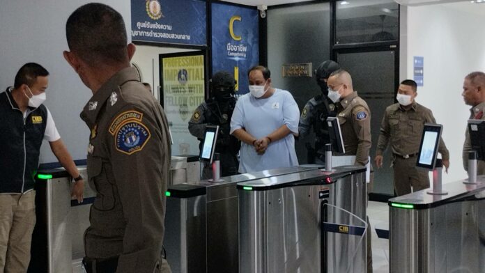 Police escort Praween Chankhlai, or Kamnan Nok, to the Criminal Court on Sept. 9, 2023. Police escort Praween Chankhlai, or Kamnan Nok, to the Criminal Court on Sept. 9, 2023.