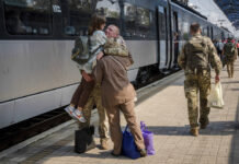 Opinion: In a World of Attention Deficit, Maintaining Attention on Issues Like Peace in Ukraine and Myanmar a Challenge A Ukrainian serviceman hugs his wife and the daughter at the railway station in Sloviansk, Donetsk region, Ukraine on Tuesday, Sept. 12, 2023. Photo: Hanna Arhirova / AP