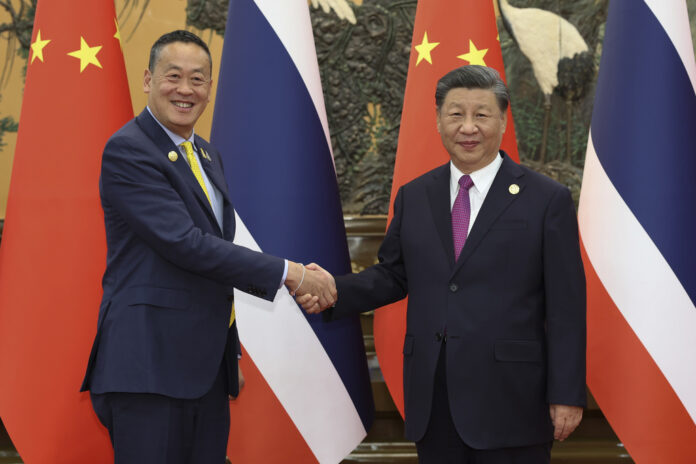 In this photo released by Xinhua News Agency, visiting Thailand's Prime Minister Srettha Thavisin, left, shakes hands with Chinese President Xi Jinping prior to their bilateral meeting at the Great Hall of the People in Beijing Thursday, Oct. 19, 2023. Thavisin meets with Xi after attending the Third Belt and Road Forum which was held on Oct. 18. Photo: Huang Jingwen / Xinhua via AP