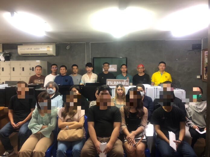 The suspects are lined up to take photos with the police after their arrests at Khlong Tan Police Station on Oct. 13, 2023. Online Gambling