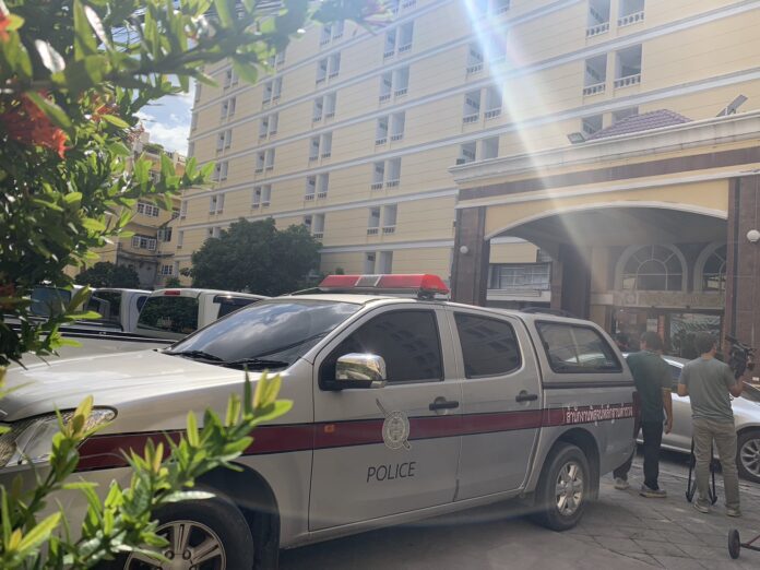 Police car is parked outside a hotel in Bangkok’s Bang Na district where a Taiwanese man is found dead inside his room on Nov. 16, 2023.