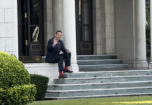 Opinion: What Institutional Investors Want to Know About Thai Politics? PM Srettha Thavisin waves to reporters as he enjoys his coffee at the steps of the Government House on Nov. 23, 2023.