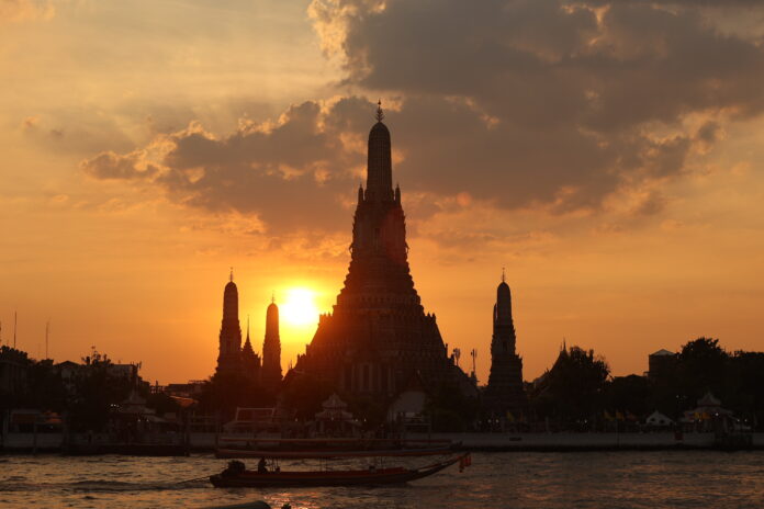 The last sunset of 2023 at Wat Arun Ratchawararam (Temple of Dawn) in Bangkok on Dec. 31, 2023.