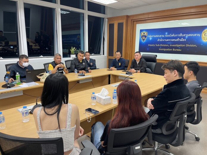 A Chinese woman is being questioned at the Immigration Bureau headquarters in Bangkok on Dec. 8, 2023. Soi Nana