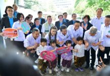 Opinion: The Government Wants More Thais to Have Children. Good Luck with That! Health minister Cholanan Srikaew and public health officials pose with children at an event to boost the birth rate on Nov. 15, 2023.
